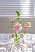 Garden-inspired bud vase arrangements for wedding reception tables