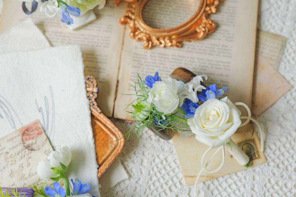 White rose boutonniere for weddings and formal events