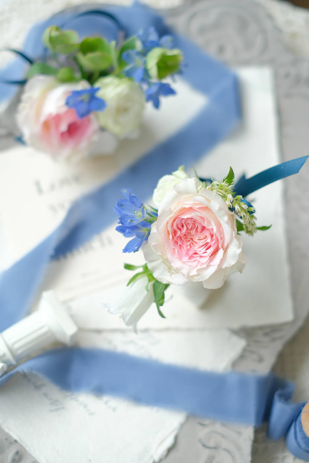 Romantic pink garden rose wedding boutonniere