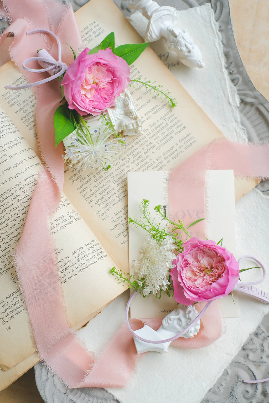 Pink garden rose boutonniere with silk ribbon