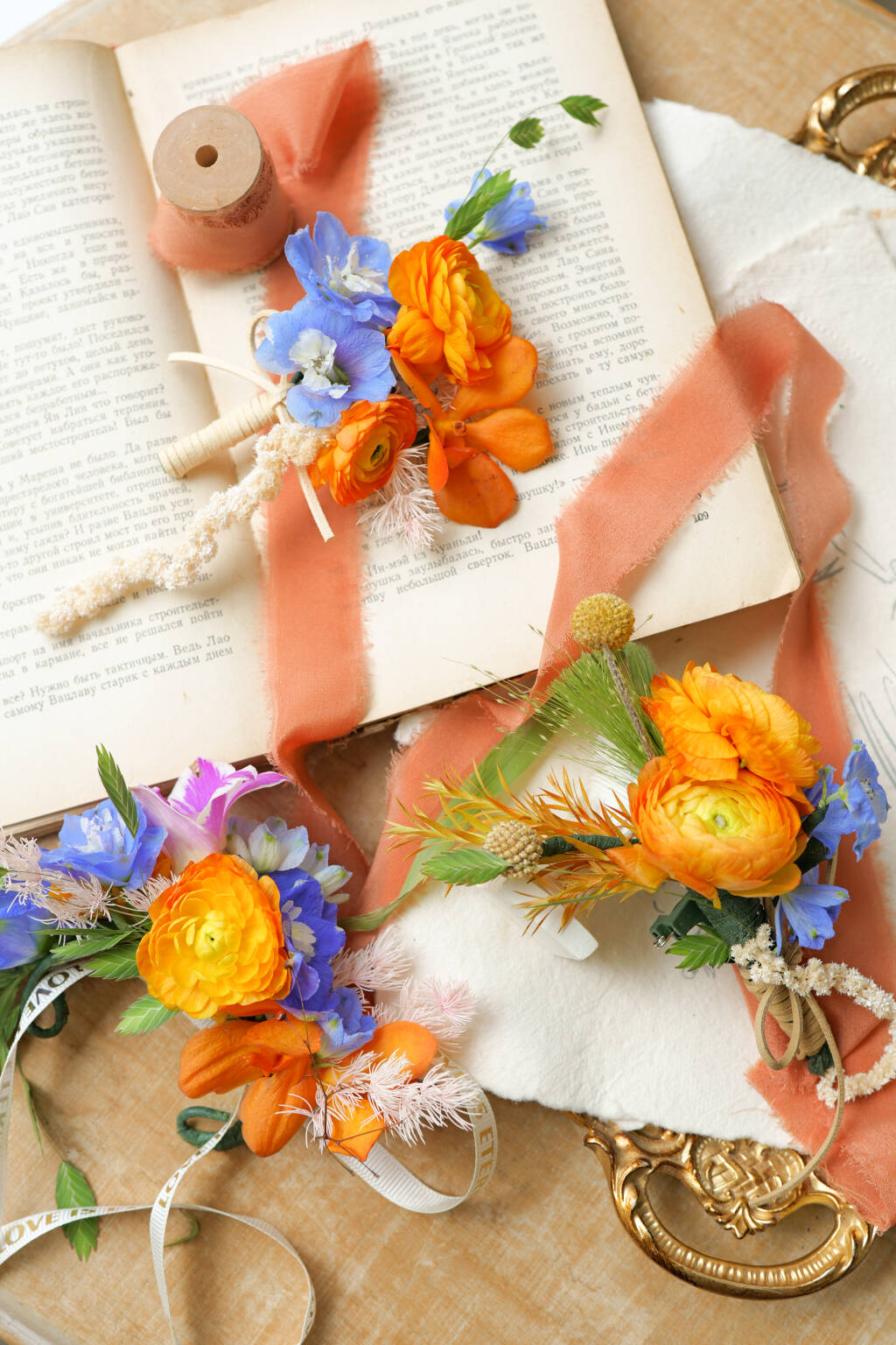 Orange ranunculus wedding boutonniere set