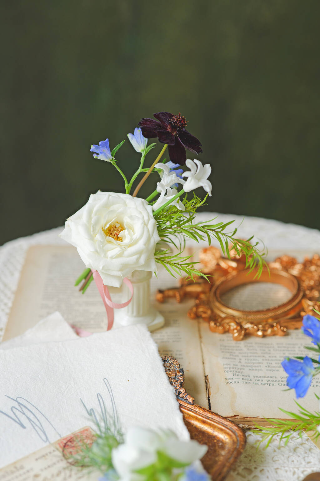 White rose wedding boutonniere with blue and purple accents