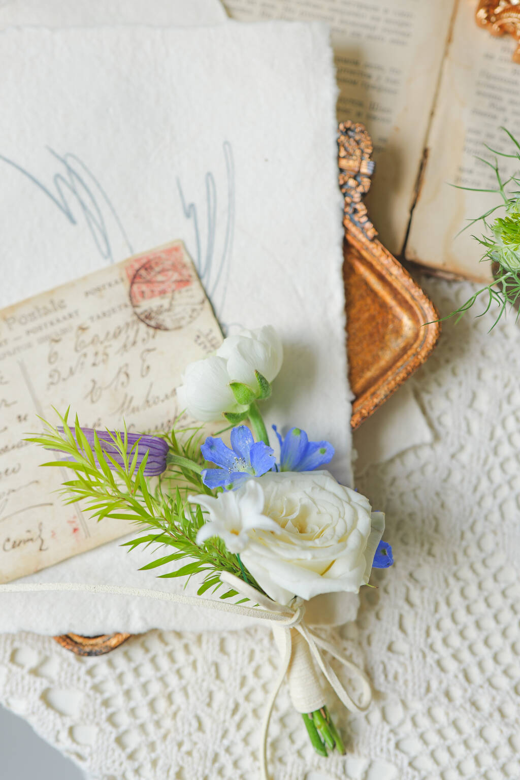 White rose wedding boutonniere with blue accents