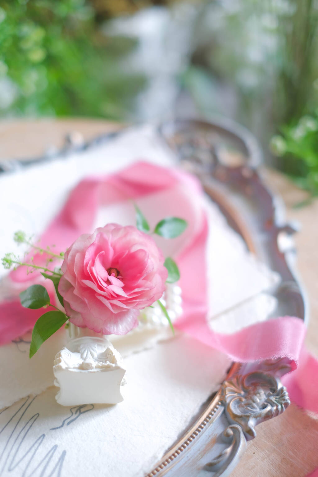 Soft pink ranunculus wedding boutonniere
