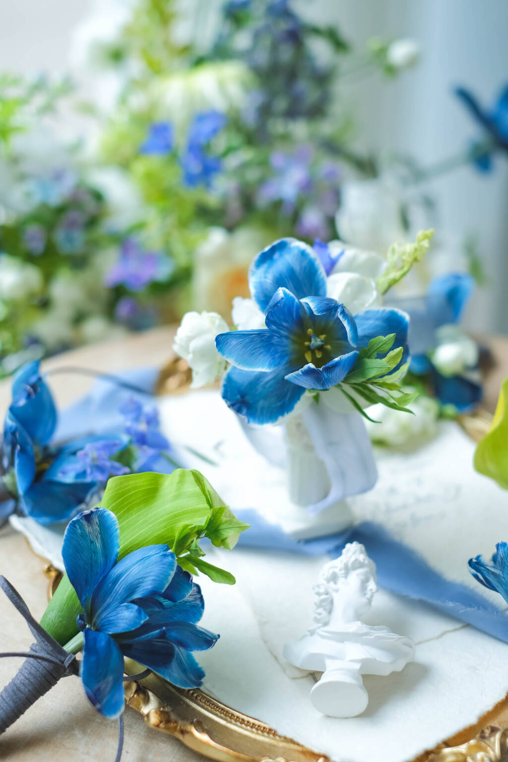 Blue tulip wedding boutonniere with modern floral design