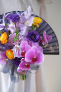Close-up of a custom floral fan bouquet designed for bridal portraits and tea ceremonies