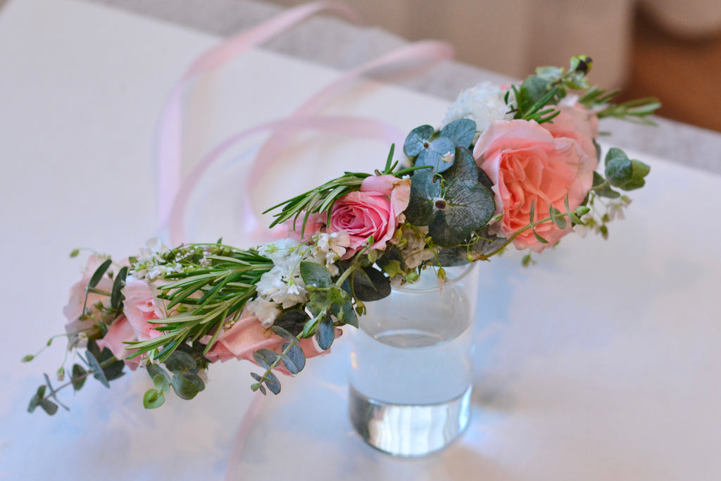 Garden style fresh flower crown with light orange and pink spray roses and greenery for weddings and special events. Bay area florist