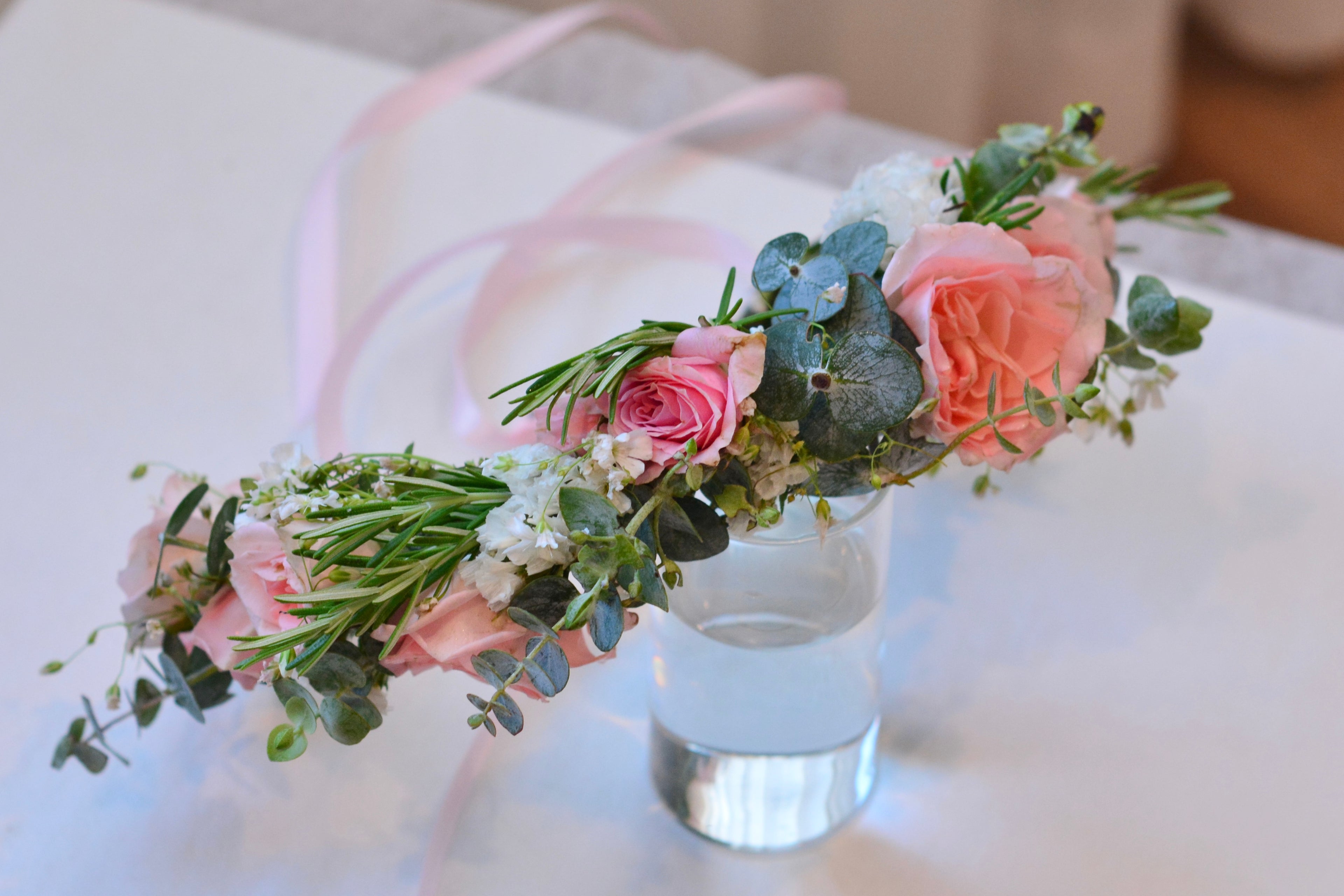 Garden style fresh flower crown with light orange and pink spray roses and greenery for weddings and special events. Bay area florist