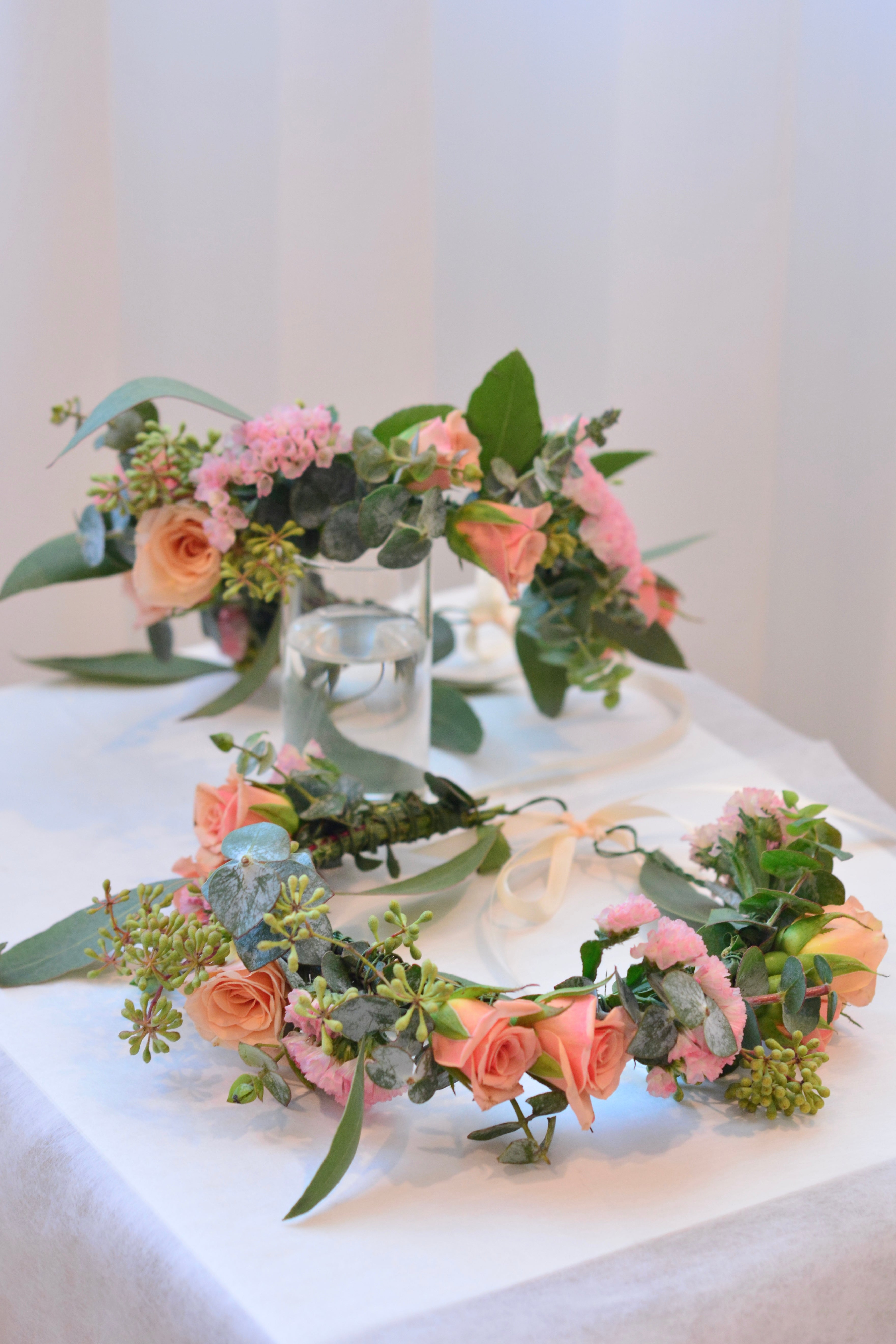 Garden style fresh flower crown with light orange spray roses and pink blooms and greenery for weddings and special events. Bay area florist